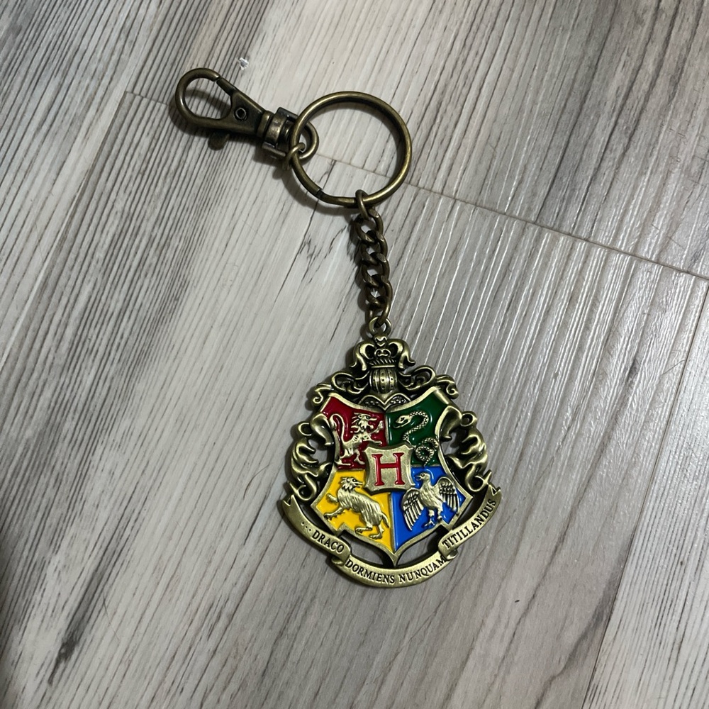 Source Unknown Gold and Multicolor Crest Keychain